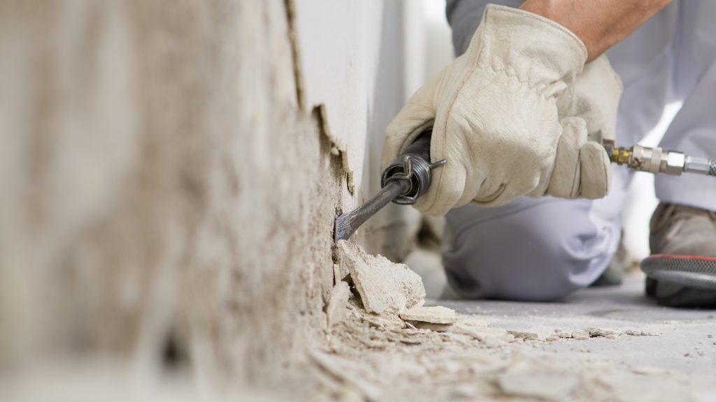 stucco repair contractor working with stucco